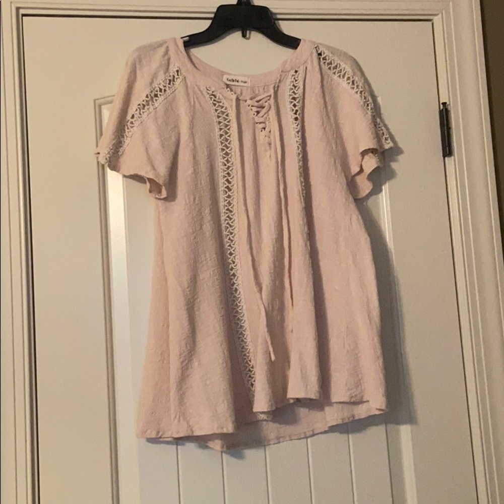 Cream / Tan top with tie in the front.